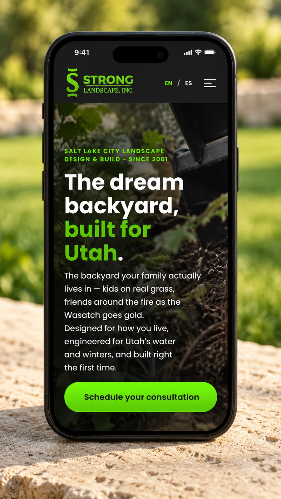 Styled phone presentation of the Strong Landscape website.